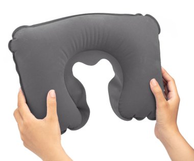 hand holding Grey neck pillow isolated on a white background