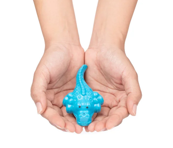 Hand holding toy plastic sand molds of sea creature isolated on — Stockfoto