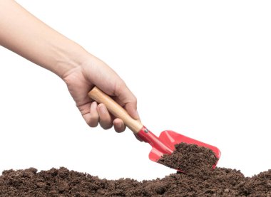 hand digging soil by shovel isolated on white background