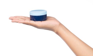 hand holding container for makeup isolated on white background