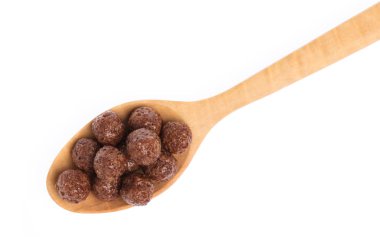 Cereal chocolate balls on spoon isolated on white background