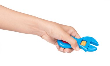 hand holding plastic adjustable spanner toy isolated on white ba