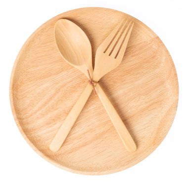 Empty wooden plate with spoon and fork isolated on white backgro