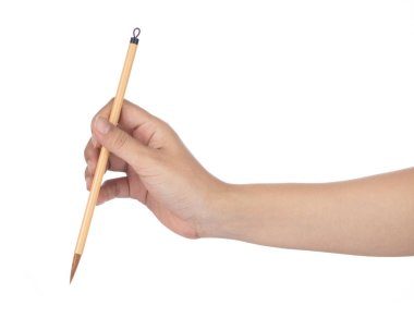Hand holding A Paint Brush isolated on white background