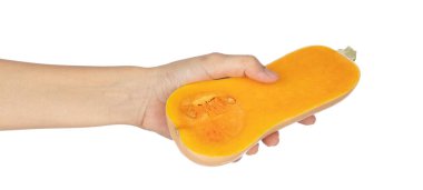 El ele tutuşup kabak ezmesi beyaz bir zeminde izole edilmiş..