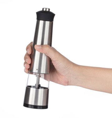 Hand holding Deluxe stainless steel table condiment bottles isol