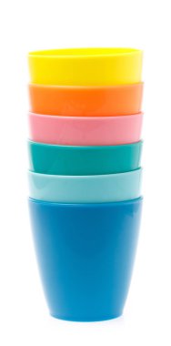 Empty colorful plastic glass isolated on white background