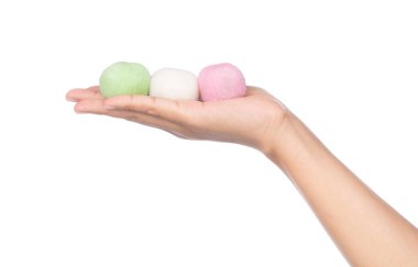 hand holding Daifuku cake isolated on white background