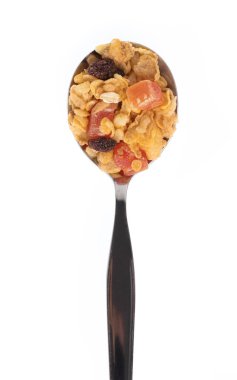 Cereal on spoon isolated on white background.