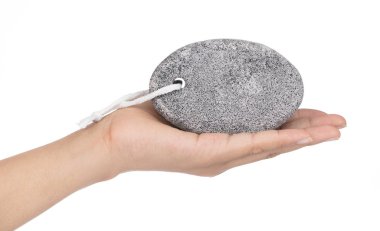 hand holding pumice stone for scrubbed and body care isolated on