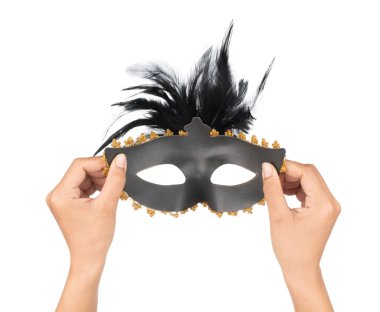 hand holding beautiful of carnival mask with feather isolated on