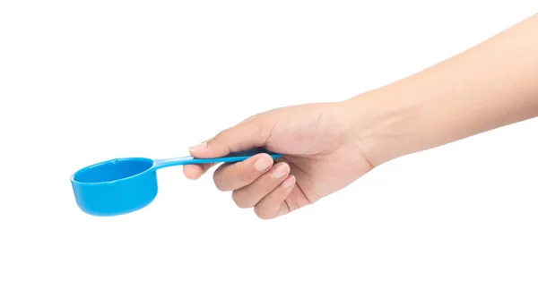 Hand holding blue plastic scoop isolated on white background — Stockfoto
