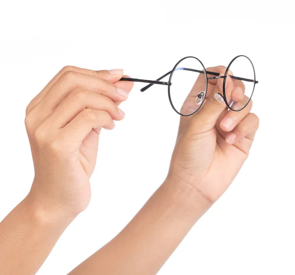 Hand holding blue eye glasses isolated on white background — Stockfoto