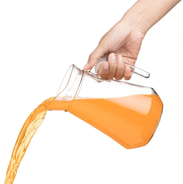 Hand pouring Peach fruit juice isolated on a white background — 스톡 사진