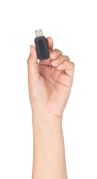 Mão segurando Um preto de memória flash USB isolado em um bac branco — Fotografia de Stock