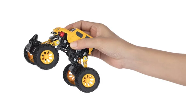 Mão segurando corrida carro modelo brinquedo crianças isolado no branco backgro — Fotografia de Stock