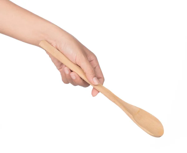 Hand holding wooden spoon isolated on white background — Stock Photo, Image