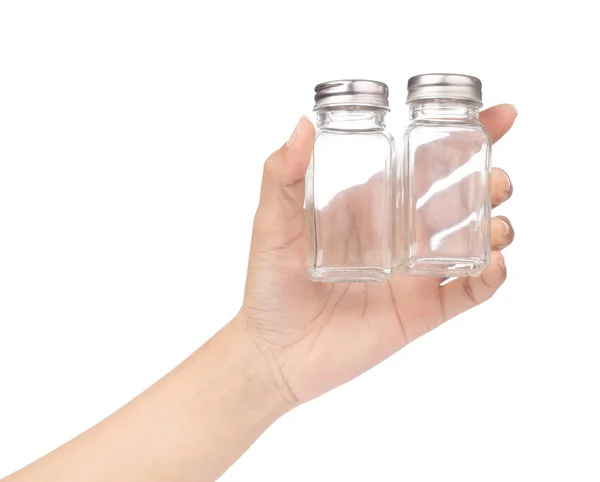 Hand holding bottle glass for seasoning isolated on white backgr — Stock Photo, Image