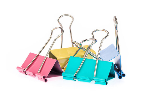 Colorful paper binder clips isolated on white background