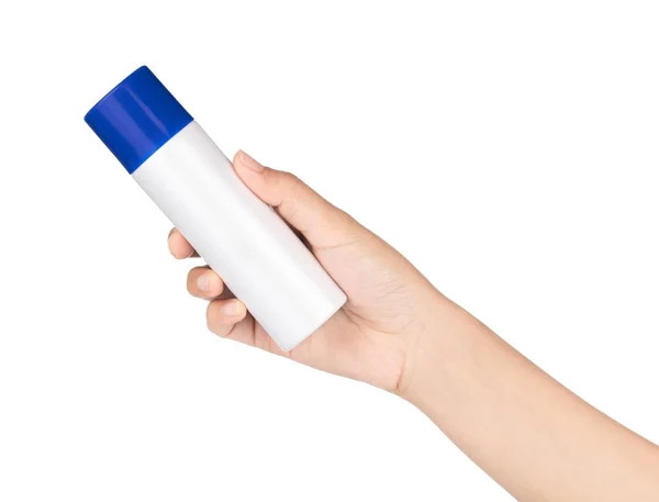 Zonnebrandcrème kan in een vrouwelijke hand, geïsoleerd op witte bac — Stockfoto