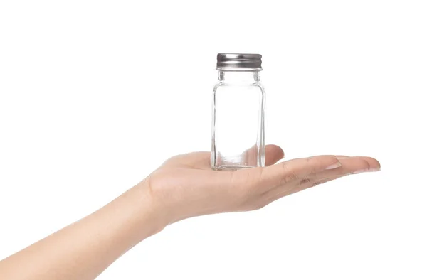 Kézben tartó üveg üveg fűszerezés izolált fehér backgr — Stock Fotó