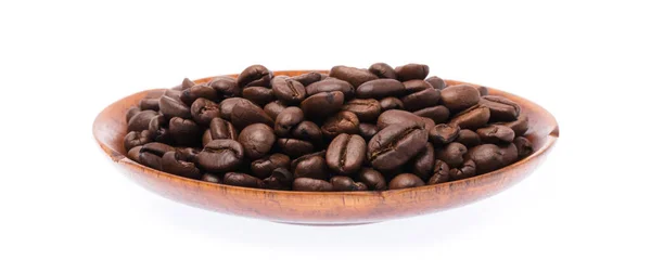 Dish of roasted coffee beans isolated on white background — Stockfoto