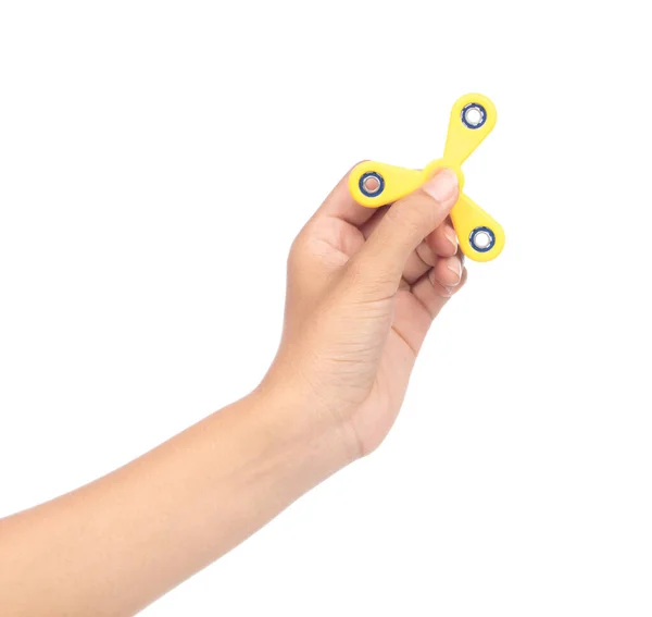 Пальці грають жовтий спінер ізольовані на білій спині — стокове фото
