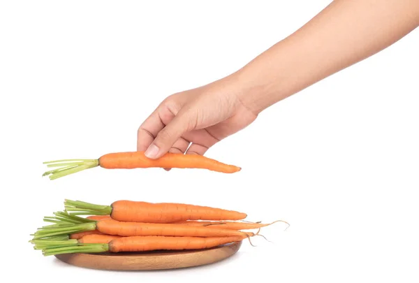 Hand holding fresh baby carrot on dish  isolated on white backgr — Stock Photo, Image