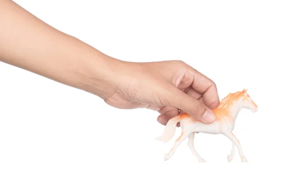 Hand holding toy plastic animals isolated on white background — Stockfoto
