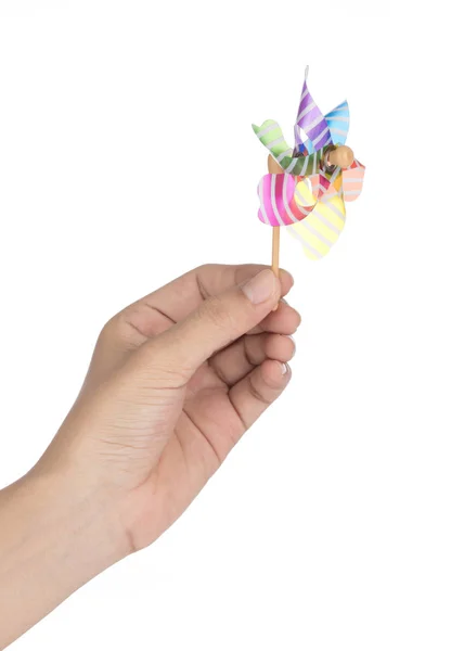 Hand holding colorful pinwheel isolated on white background — Stock Photo, Image