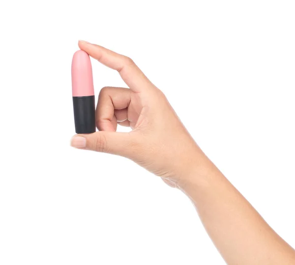 Hand holding Nude lipstick tube isolated on white background. Pi — ストック写真