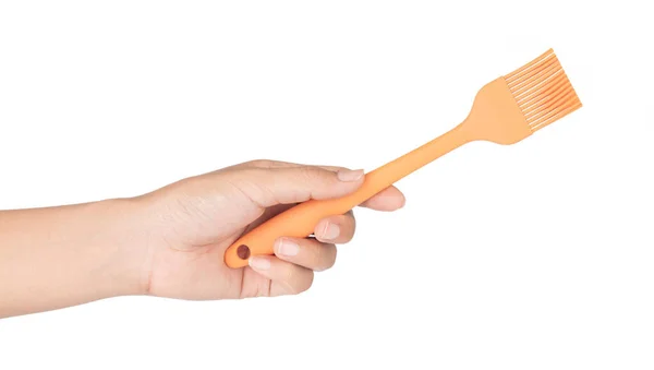 Hand holding Silicone brush for cooking isolated on white backgr — 图库照片