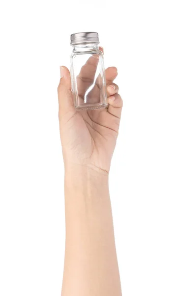 Рука держа стакан бутылки для приправы изолированы на белом backgr — стоковое фото