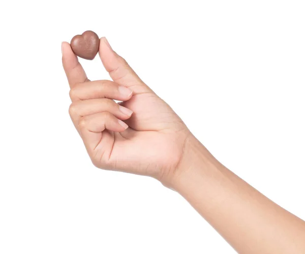 Hand holding Chocolate heart isolated on a white background — ストック写真