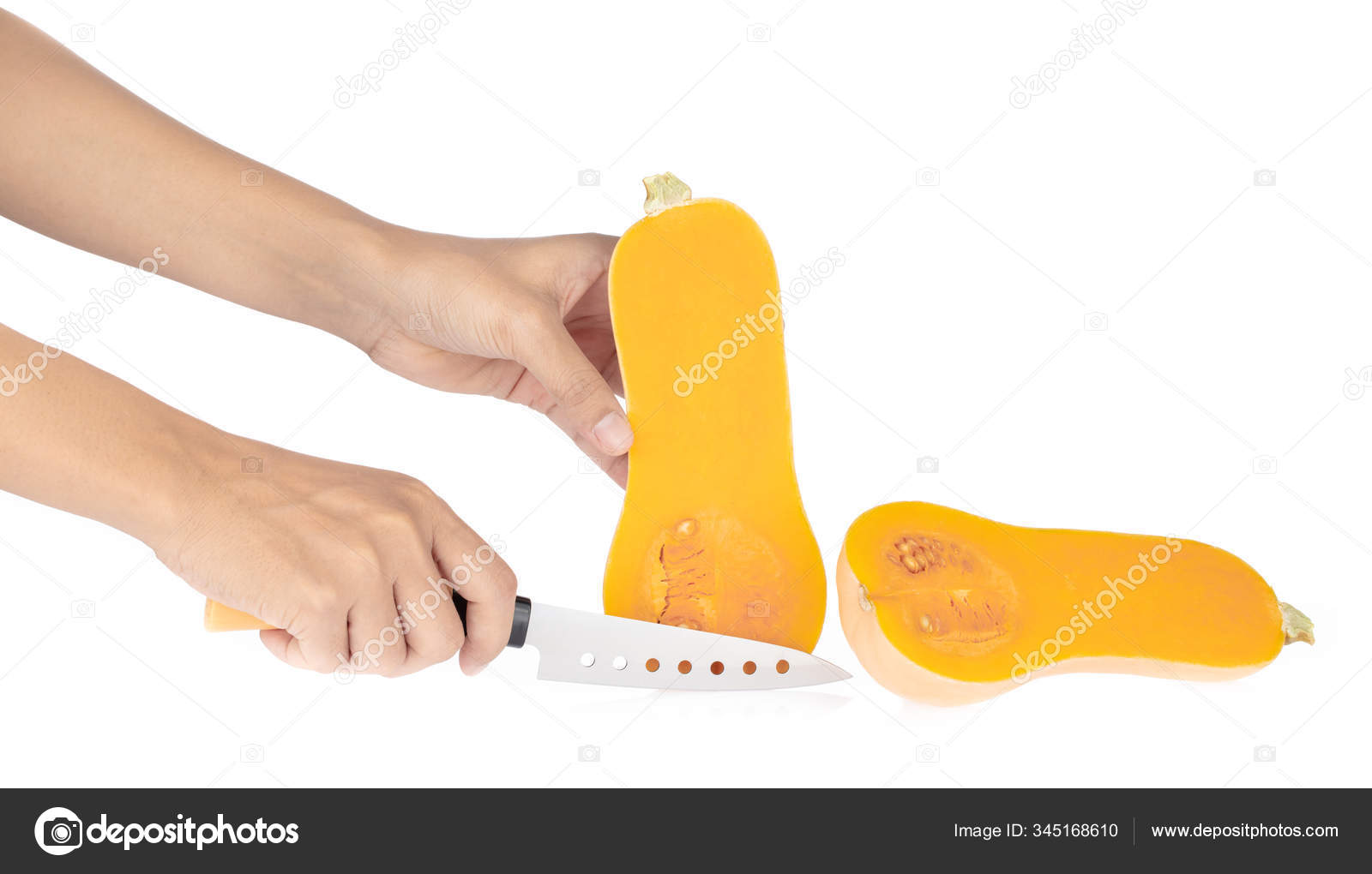 Girls hands cut butternut squash isolated on a white background. Stock