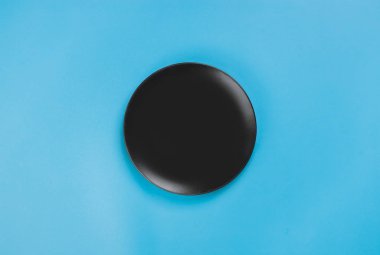 A black plate on blue background