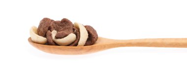 Cereal chocolate on spoon isolated on white background