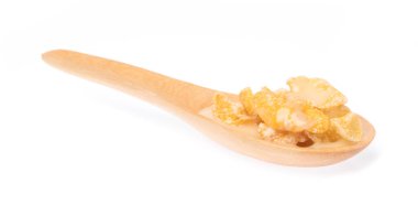 Cereal on spoon isolated on white background.