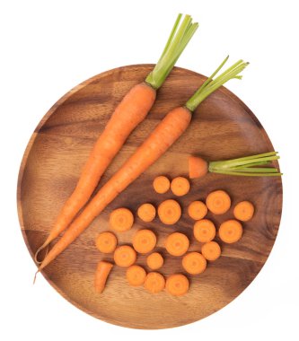 fresh baby carrots on wood dish isolated on white background