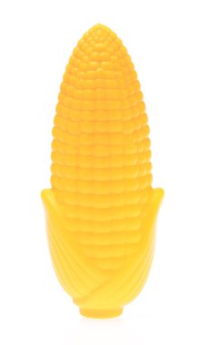 plastic toy corn isolated on white background