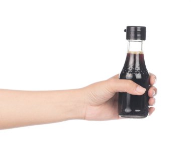 hand holding Soy Sauce bottle isolated on white background.