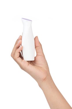 Hand holding cosmetic bottle isolated on white background