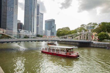 SINGAPORE - FEBRUARY 19, 2017: Tourist boat on the Singapore riv