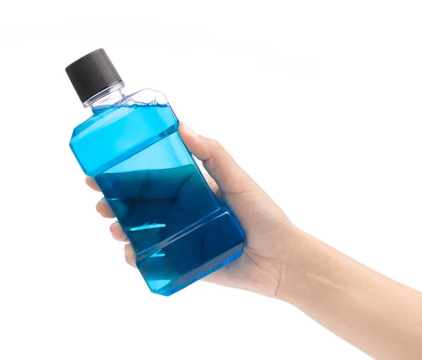 Hand holding blue water mouthwash isolate on white background — ストック写真