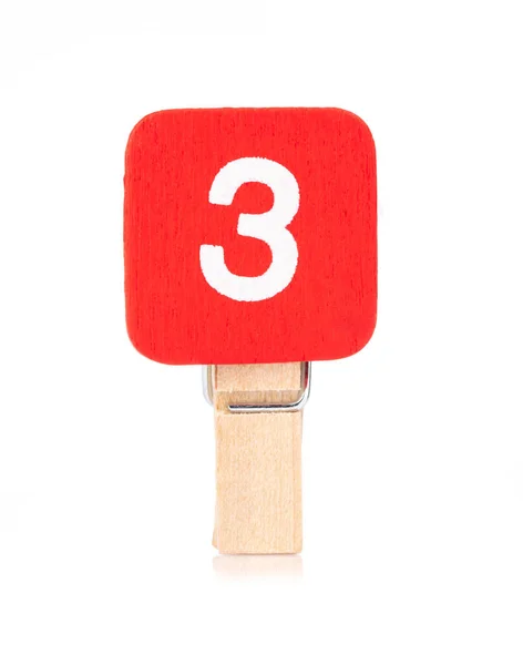 Clipe de madeira peg com números 3 isolado em um fundo branco — Fotografia de Stock
