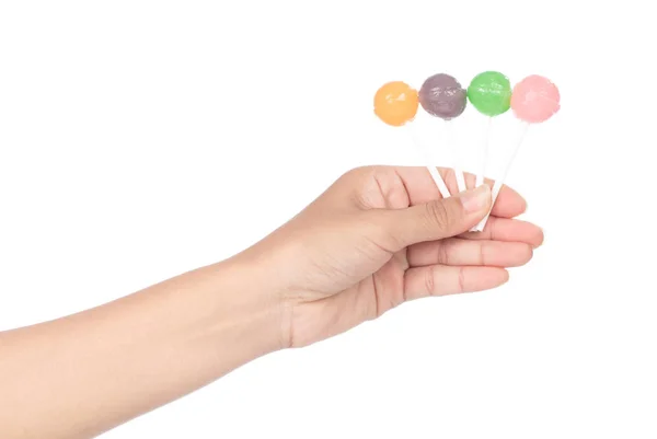 Hand hält Lutscher Bonbons isoliert auf weißem Hintergrund — Stockfoto
