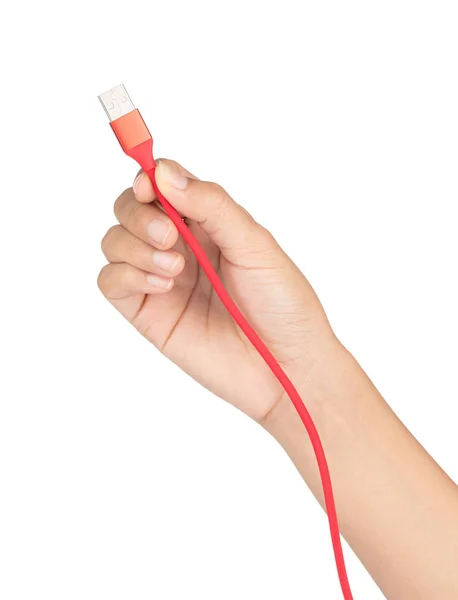 Mão segurando cabo USB vermelho para smartphone isolado na parte traseira branca — Fotografia de Stock