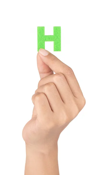Hand holding Alphabet H is made of felt isolated on white backgr — Stockfoto
