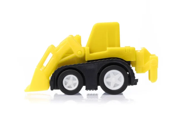Іграшковий трактор ізольований на білому тлі . — стокове фото