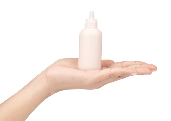 Hand holding makeup liquid foundation isolated on white backgrou — Stock Photo, Image